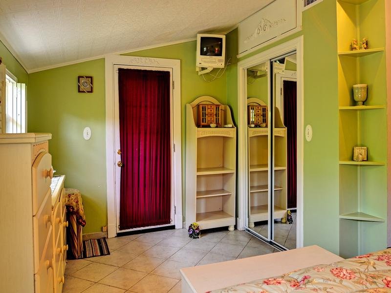 Fully furnished master bedroom has exterior access